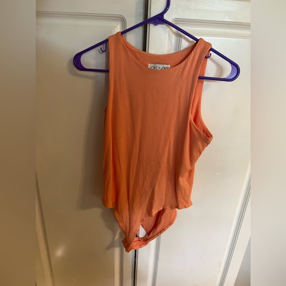 Boutique peachy color body suit, worn once or twice.